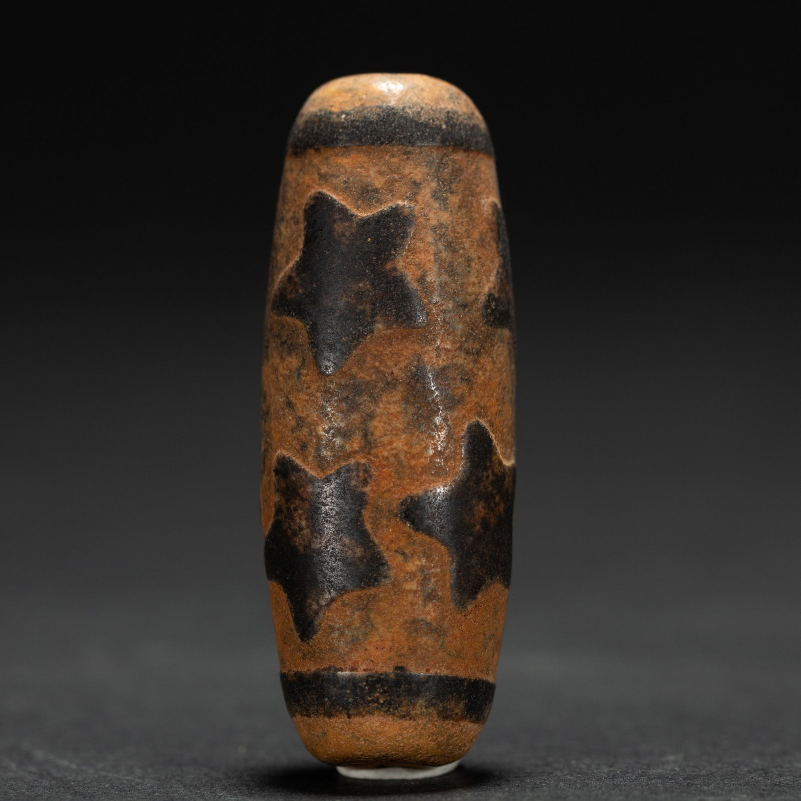 A TIBETAN DZI BEAD: L. 5.2 cm. cm. Weight 30 gram.