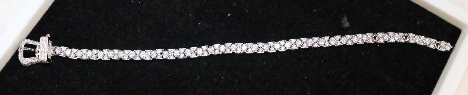 Sterling Silver CZ' buckle bracelet NEW: Weighs 22.1 grams. Bracelet is 9" long with openings at 7.5", 8" and just shy of 9" . Clasp opens to slide chain through then closes over the chain once you pass the chain through the buckle for added