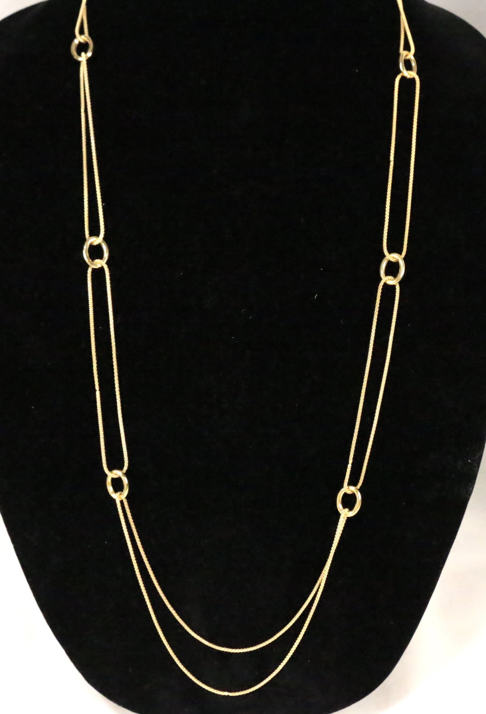 Sterling Silver Gold Clad Milor Italy Double chain necklace: Stamped 925 MILOR ITALY. Brilliant gold clad with oval station links on this double popcorn chain drape necklace. Necklace is 36" long. Weighs 14.9 grams. Looks new. Brilliant gold shine.