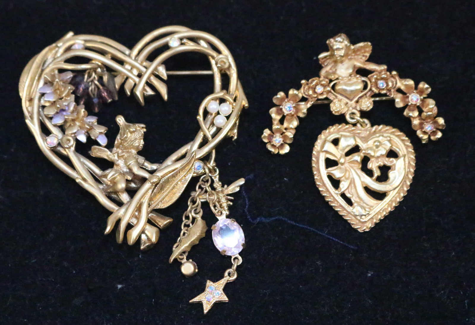 Lot of 2 Kirks folly Gold Fairy Brooches: Lovely brushed gold fairies and hearts with pearls crystals cherub brooches in excellent condition. Large swirl brand heart is 2.5" long x 2.5". Brooch with Cherub and heart has a lovely drpein g flor