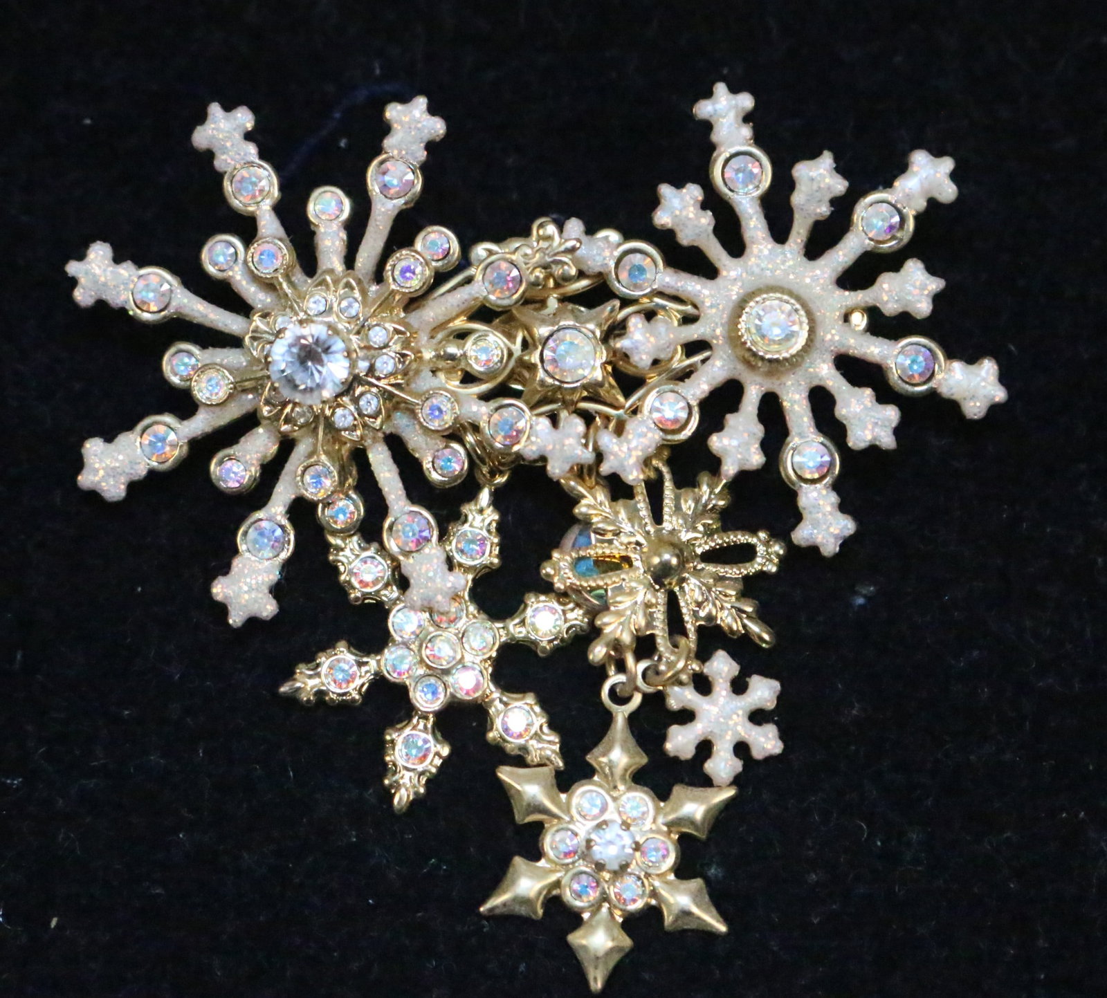 Kirks Folly Large multiple snowflake dangling brooch: Measures: 2.5" x 2.5" Multiple crystal and sparkle snowflakes Great condition.