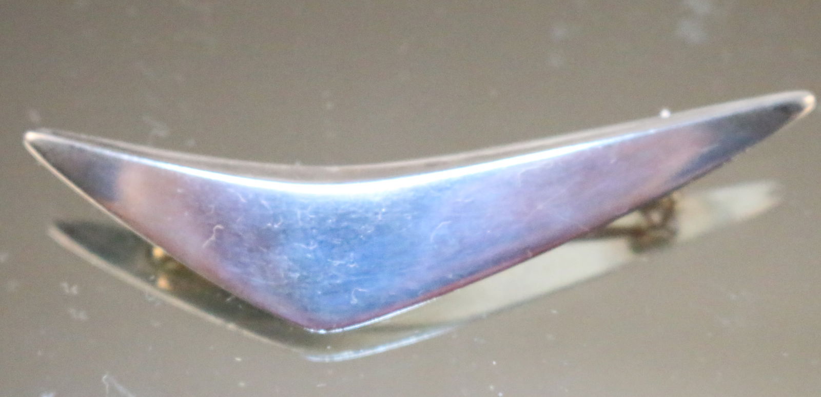 Vintage Hans Hansen Denmark Modernist Boomerang Style Brooch Pin: STAMPED: Signed Hans Hansen with various numbers etched and stamped 925s Denmark. DETAILS: MODERNIST Boomerang triangular design large brooch/pin. Smooth angled finish. DIMENSION:3" long x 5/8" high.