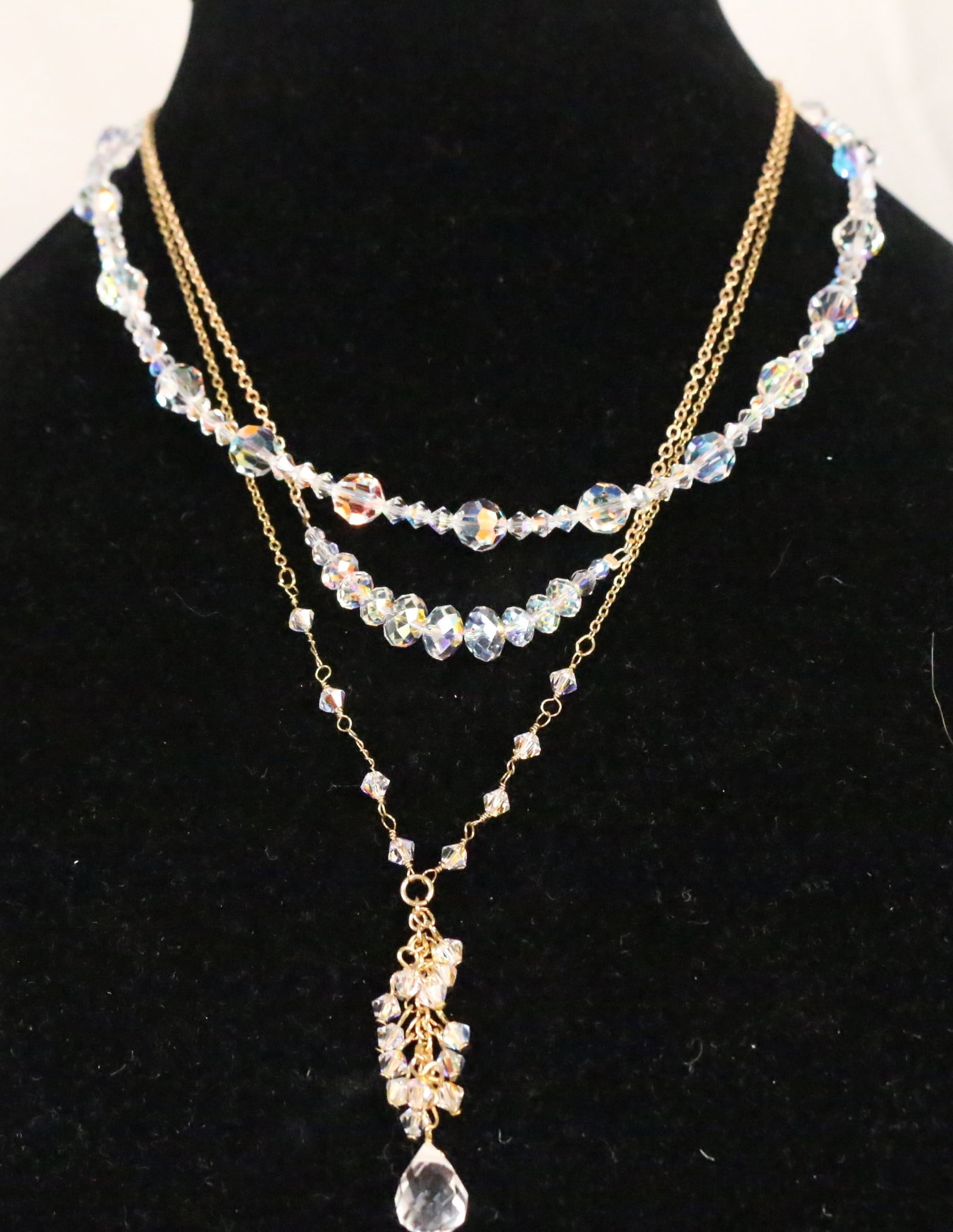Kirks Folly Lot of 3 faceted bead Necklaces: STAMPED: Kirks Folly DETAILS: 2 gold tone necklaces and 1 silver tone. All have Faceted Aurora Borealis Beads in varying sizes. DIMENSION: Drop Crystal necklace is 18" - 21" with the chain extender. F