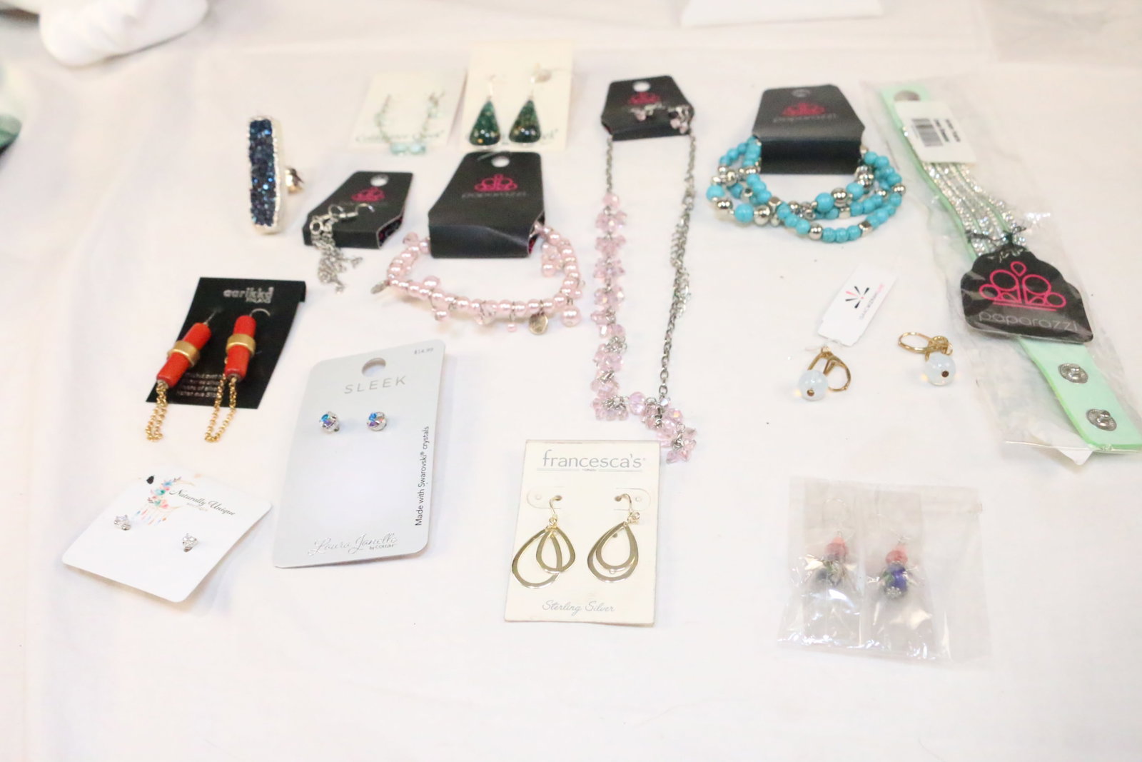 Large Lot of 14 New modern jewelry Isaac Mizrahi, Coldwater Creek more: Earrings, Rings, Necklaces and bracelets lots. ALL BRAND NEW on the Cards. GREAT RESALE LOT! Name Brands: Coldwater Creek 2 pair Earrings, Francesca's, Laura Janelle, Paparazzi, Isaac Mizrahi Live,Ari