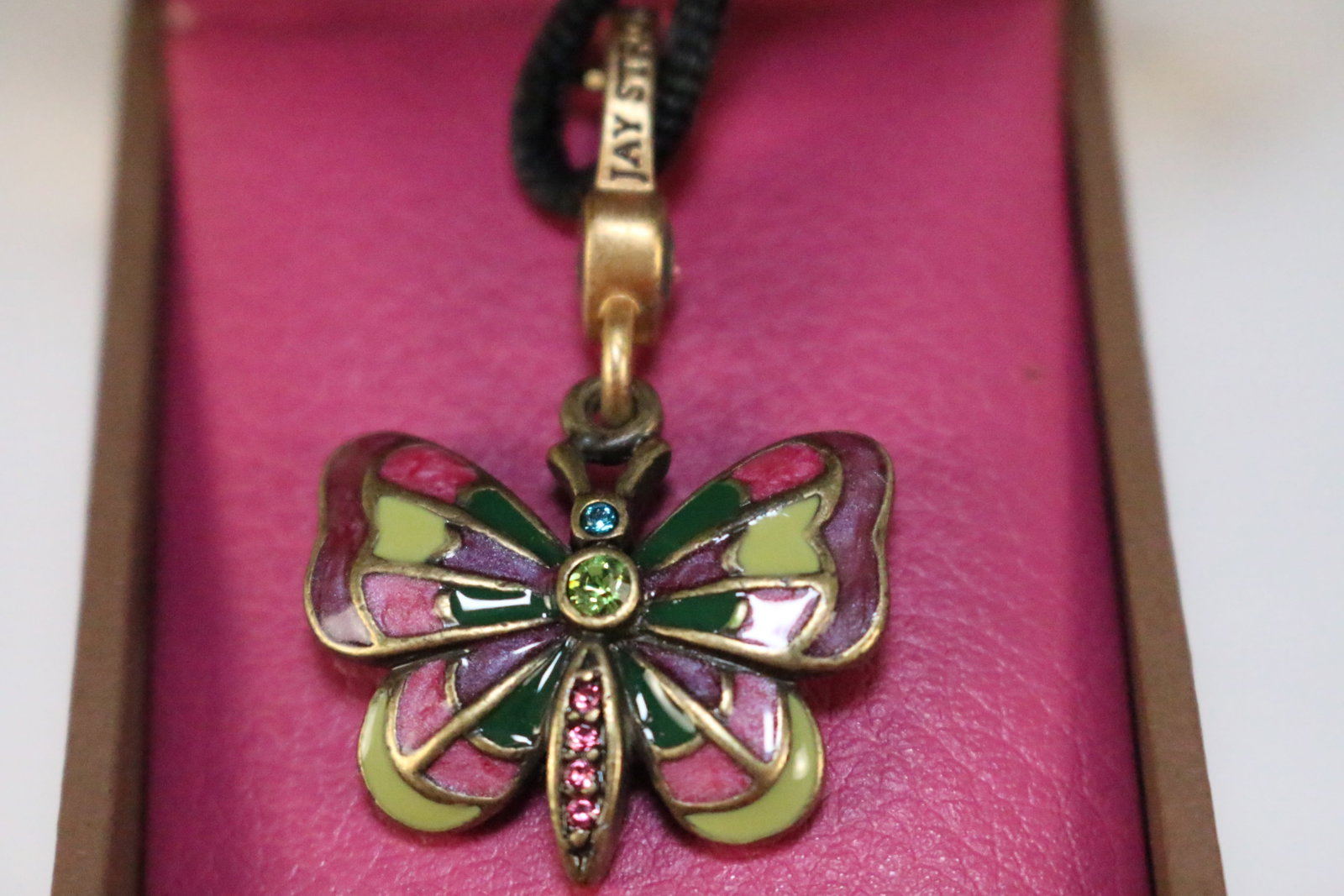 NEW Jay Strongwater Butterfly Charm Necklace in the box: SIGNED: Jay Strongwater JS DETAILS: Great gift idea. Black fabric cord with lobster clasp end necklace. Can be removed and used on a bracelet, ,zipper pull, handbag .In original box with paperwork. SI