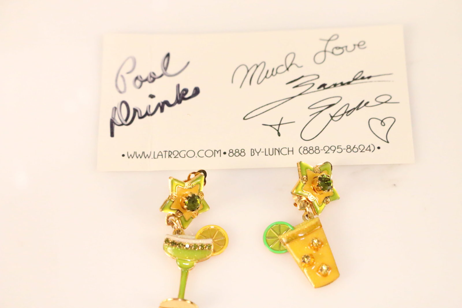 Vintage 22kt GP Lunch at the Ritz LATR2GO USA Pool Drinks Clip Earrings: SIGNED: LATR2GO USA. Signed Card "Much Love Zander & Esme" DETAILS: Green and yellow enamel and crystals pool drinks, lemon limeade and a margarita. Star posts. Clip Earrings. SIZE/DIMENSIONS: Approx.