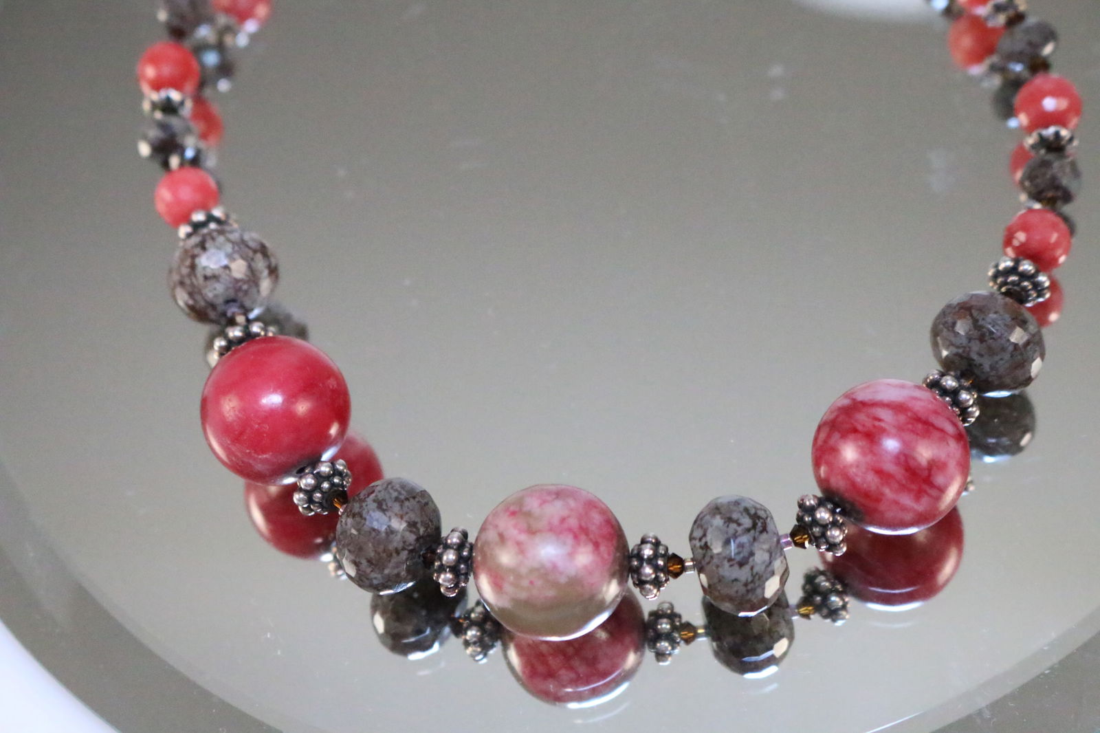 Sterling Silver Red & Green Stone Beaded Necklace: SIGNED: 925. DETAILS: Gorgeous smooth and faceted natural stones that appear to be rhodonite & Jasper in shades of deep Fuscia, red, pink white, green gray and brown. With Sterling caviar beaded space