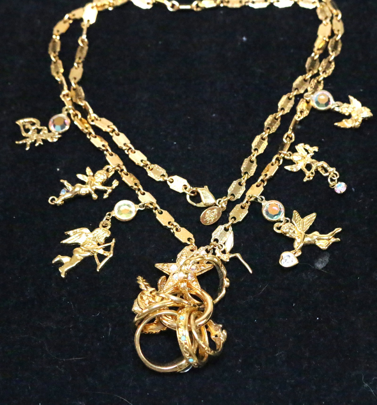 NEW Kirks Folly Love Rings Fairies Stars Hearts Gold tone Necklace in box 30": DESCRIPTION: Bright gold tone. Long 30" brand new in the box. Signed KIRKS FOLLY. DIMENSIONS: 30" long
