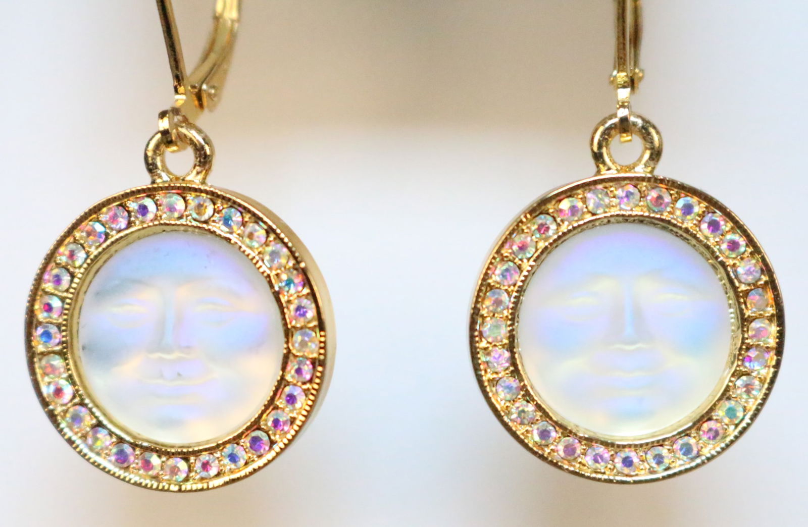 Kirks Folly Gold tone ab encrusted crystal Seaview moon pierced gold tone earrings.: DESCRIPTION: Look new bright gold tone Seaview moon lever back pierced earrings. Signed Kirks Folly. DIMENSIONS: 3/4" diameter. 1.25" drop.