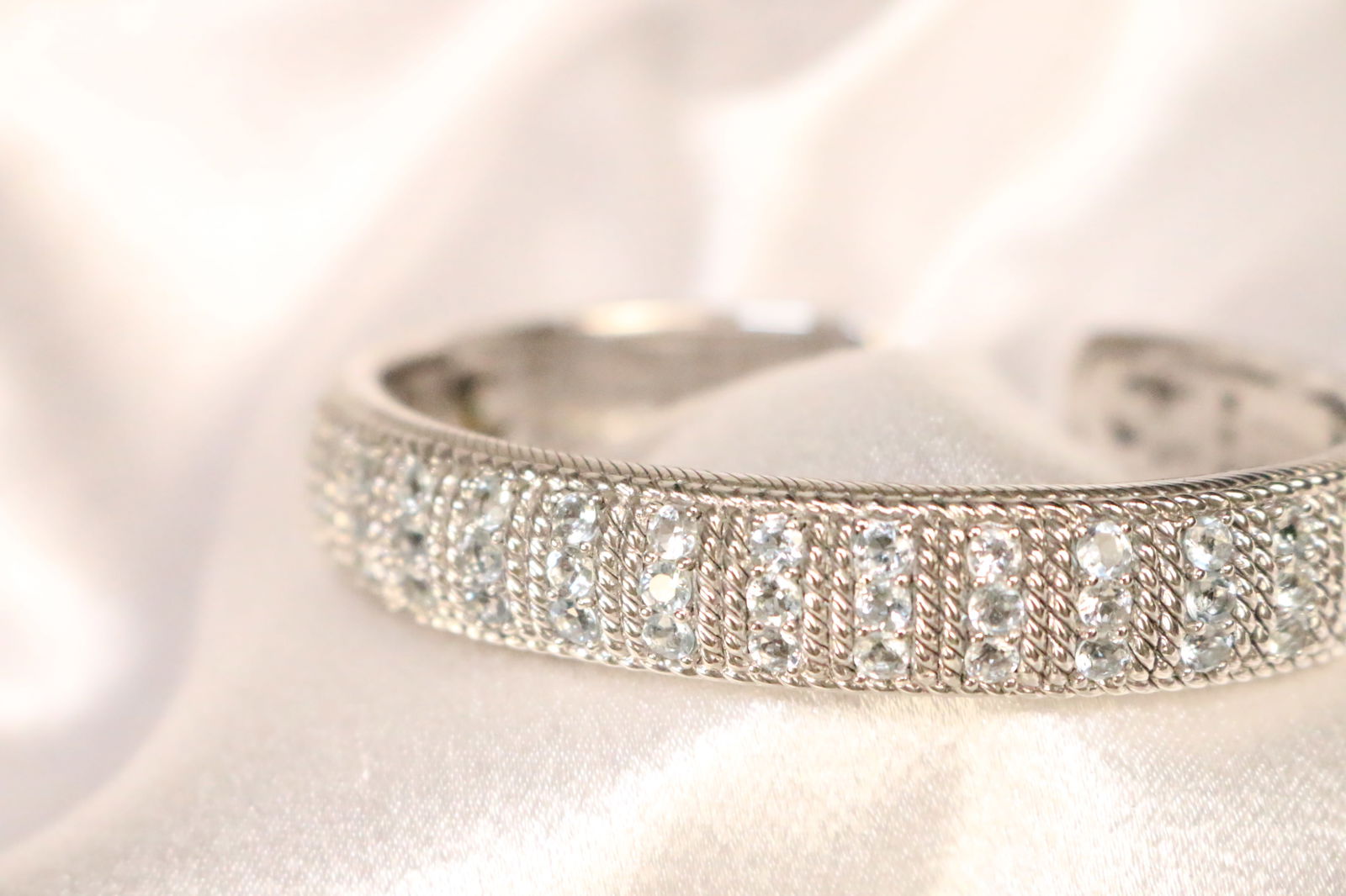 RARE Judith Ripka Sterling Silver 13 columns brilliant CZ's aquamarine Wide Cuff Bracelet in the box: DESCRIPTION: BRILLIANT LARGE full cut 39 CZ's IN 13 columns. these have a faint blue cast to them appearing like AQUAMARINE. JUST GORGEOUS AND VERY RARE! I've never seen one in such a lovely shade! Th