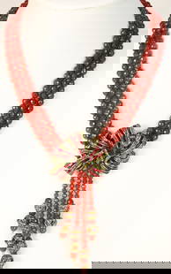 RARE Heidi Daus Red Ravishing Ribbon Carnelian Bow Lavalier Necklace: DESCRIPTION: Stunning Red Carnelian 3 row faceted individually hand knotted beads with a stunning bow of Brilliant red baguette Swarovski crystals and clear crystals in the large bow with 4 Carnelian