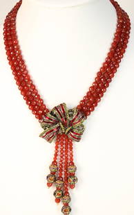 RARE Heidi Daus Red Ravishing Ribbon Carnelian Bow Lavalier Necklace: DESCRIPTION: Stunning Red Carnelian 3 row faceted individually hand knotted beads with a stunning bow of Brilliant red baguette Swarovski crystals and clear crystals in the large bow with 4 Carnelian