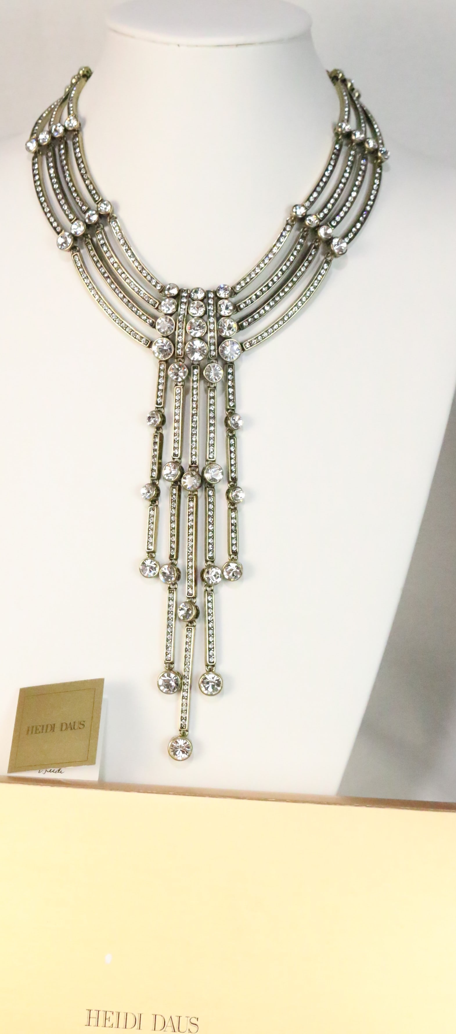 NEW RARE Heidi Daus Art Deco Modernist MAGNIFICENT Huge Lavalier Necklace: SPECTACULAR HUGE Loaded with so many huge clear crystals in graduating 3 rows with 5 strand drop. Adjustable length chain.17.5" - 20.5" Beaded ball chain end. ULTRA Luxurious. Perfect for the Holiday 