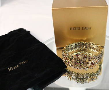 NEW HEIDI DAUS Merci Beaucoup Swarovski Crystal Golden Bracelet RETAIL $240: DESCRIPTION: BRAND NEW in the Gold Heidi Daus Box in the black Heidi Velvet Bag with insert. RETAIL $250. Stunning Amethyst, burgundy, smoked topaz, light Colorado topaz and olivine Swarovski