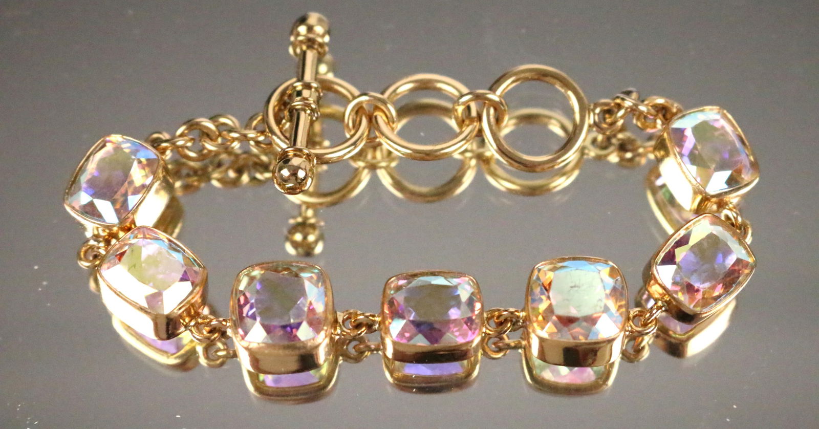 Charles Albert Alchemia Gold Mercury AB Toggle Bracelet: Charles Albert Alchemia Gold Mercury colorful AB colored stones toggle bracelet. Measures 8" with 3 links. Can be worn at 7", 7.5" or 8" lengths.