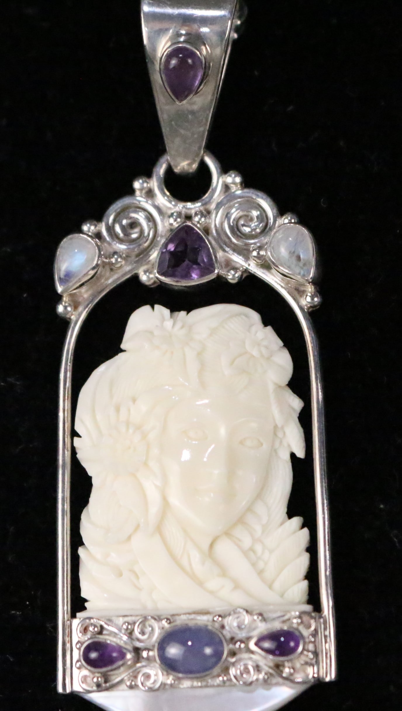 Large Sajen Sterling Silver Carved Bone Amethyst Moonstone MOP Goddess Pendant: HALLMARKED: SAJEN 925. Measures: 3-1/8" x 1-1/8". Gorgeous ivory color bone carved goddess Asian with flowers set in Sterling silver, tested Amethyst gemstones, moonstone and mother of pearl. Large ba