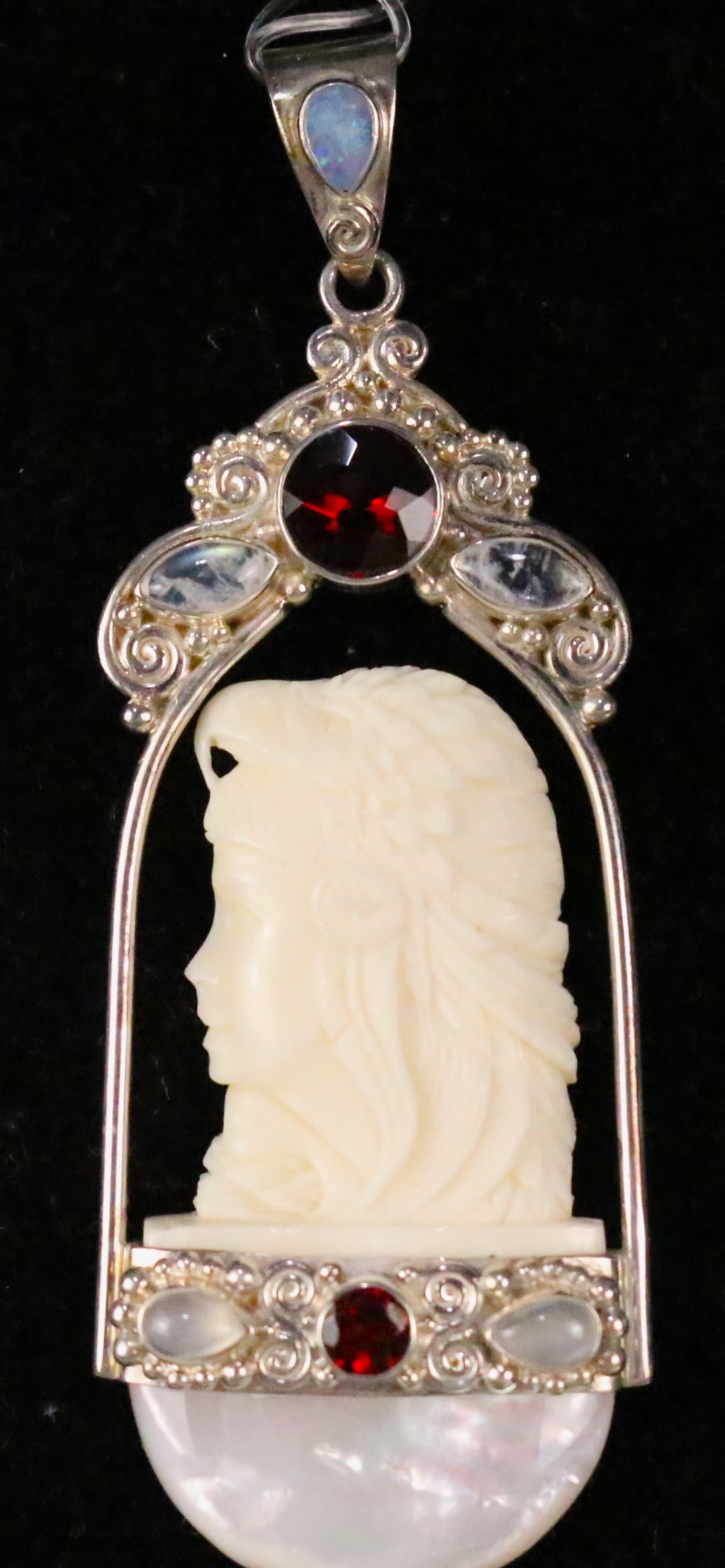 Large Sajen Sterling Silver Carved Bone Red tourmaline, Moonstone MOP Goddess Pendant: HALLMARKED: SAJEN 925. Measures: 3-3/4" x 1-1/4". Gorgeous Ivory colored carved bone large goddess long flowing hair . Set in sterling silver, red tourmaline, rainbow moonstone, moonstone and mother o