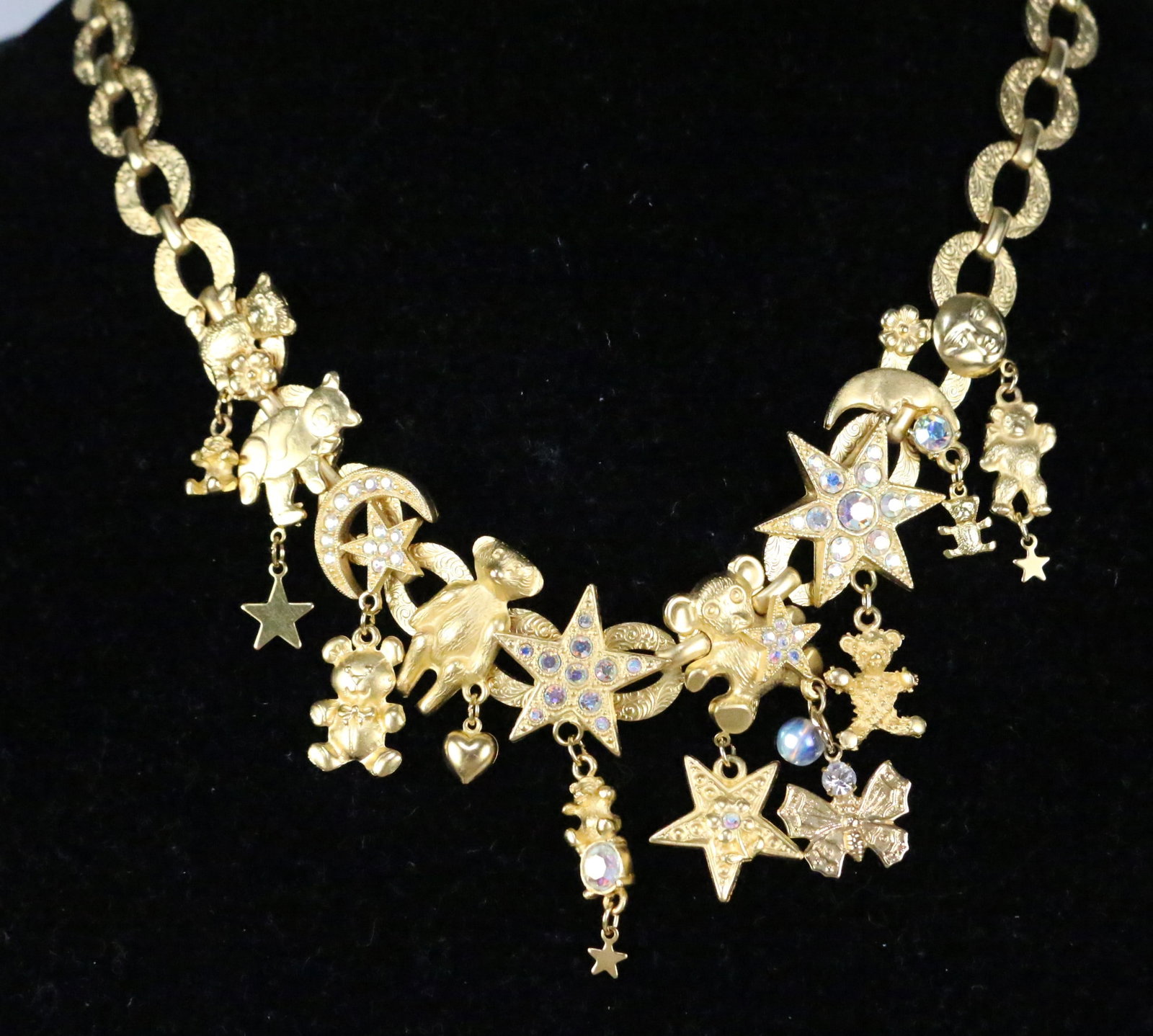 NEW RARE Kirks Folly Textured Brushed gold Bears Moon stars Necklace in the box: BRAND NEW In the Pink Kirks Folly box. RARE LARGE TEXTURED OVAL LINKS, TEDDY BEAR ENDS, ASSORTED BEARS TEDDIES IN DESIGNS AND TEXTURES ATTCHED TO THE LINKS AND ALSO CHARM DROPS. CRYSTAL MOONFACE, CRES