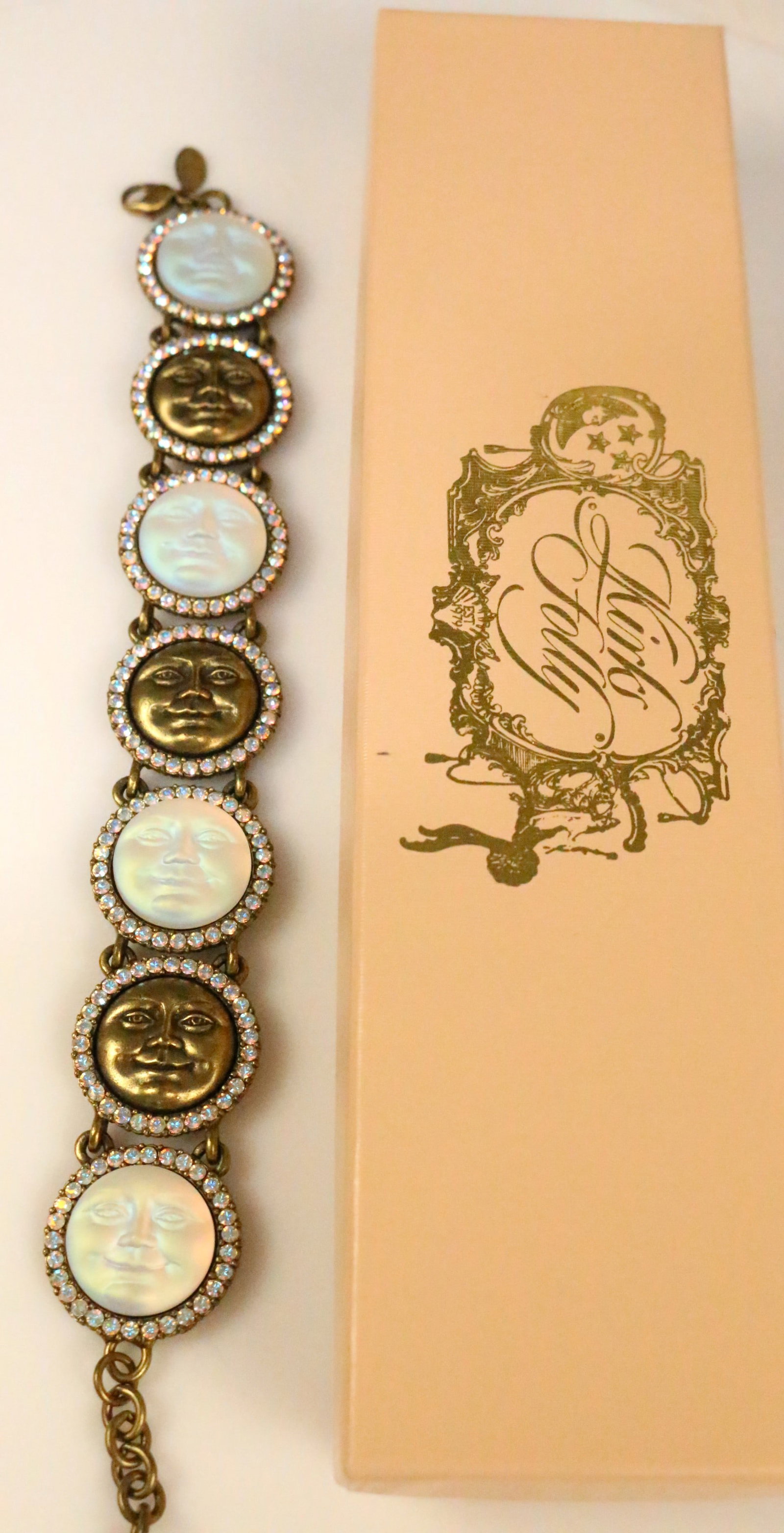 NEW ULTRA RARE Kirks Folly 7 Moonface Crystal Link bracelet in box w/tag: ULTRA RARE To find this NEW in the box with the tag! 7 large Moonface surrounded by AB crystals. Alternating moonface in Mother of pearl and Brass/ bronzetone on bronze link chain. Comes with Kirks Fo