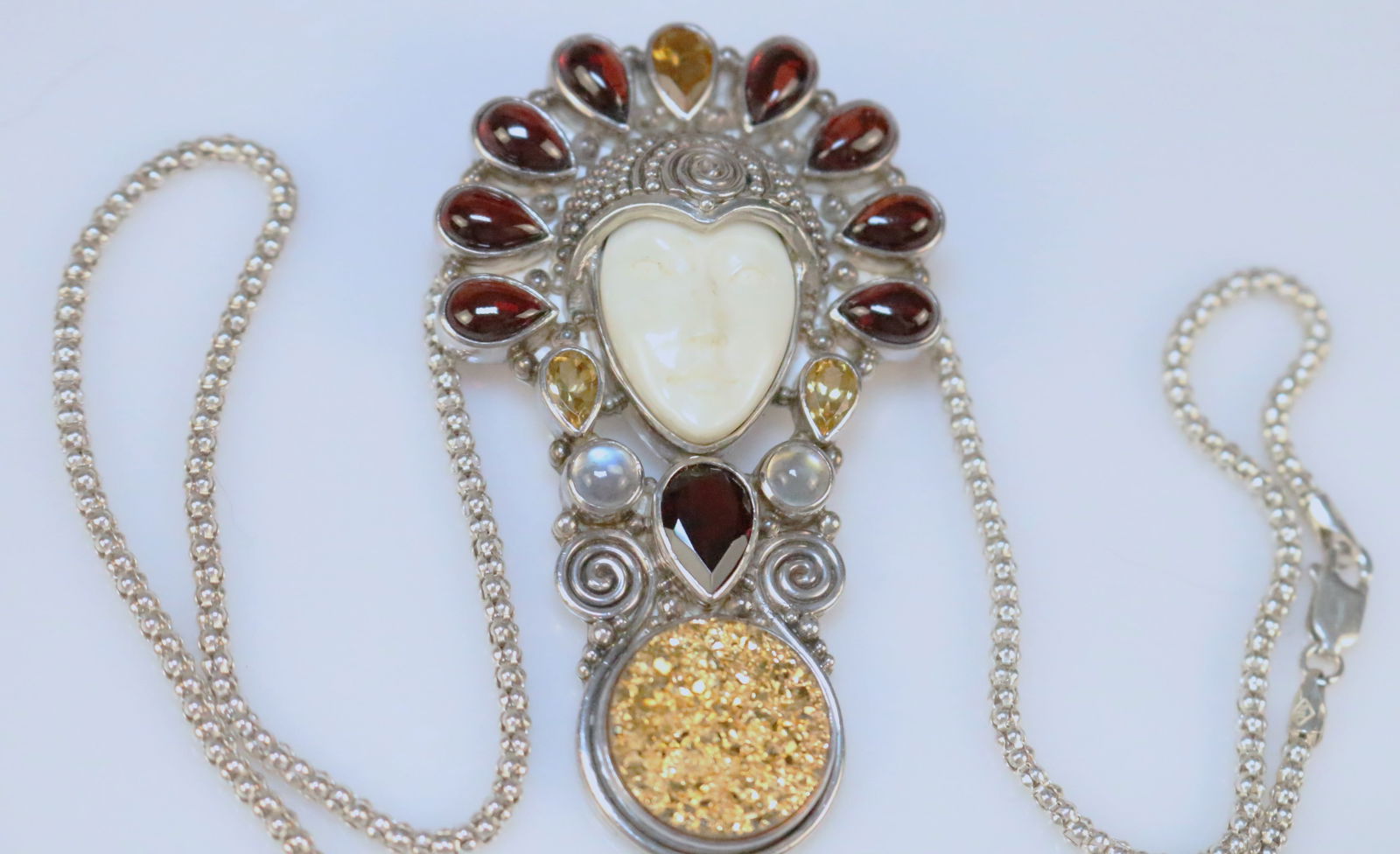 RARE Sajen Gold druzy Multi Gemstone Huge Ivory bone color Carved goddess Brooch Pendant Necklace: Stunning HUGE Ivory bone carved goddess with a huge headdress of GEMSTONES in citrine, garnet, moonstones and a large round gold druzy stone set in sterling silver. This is a brooch and pendant. Comes