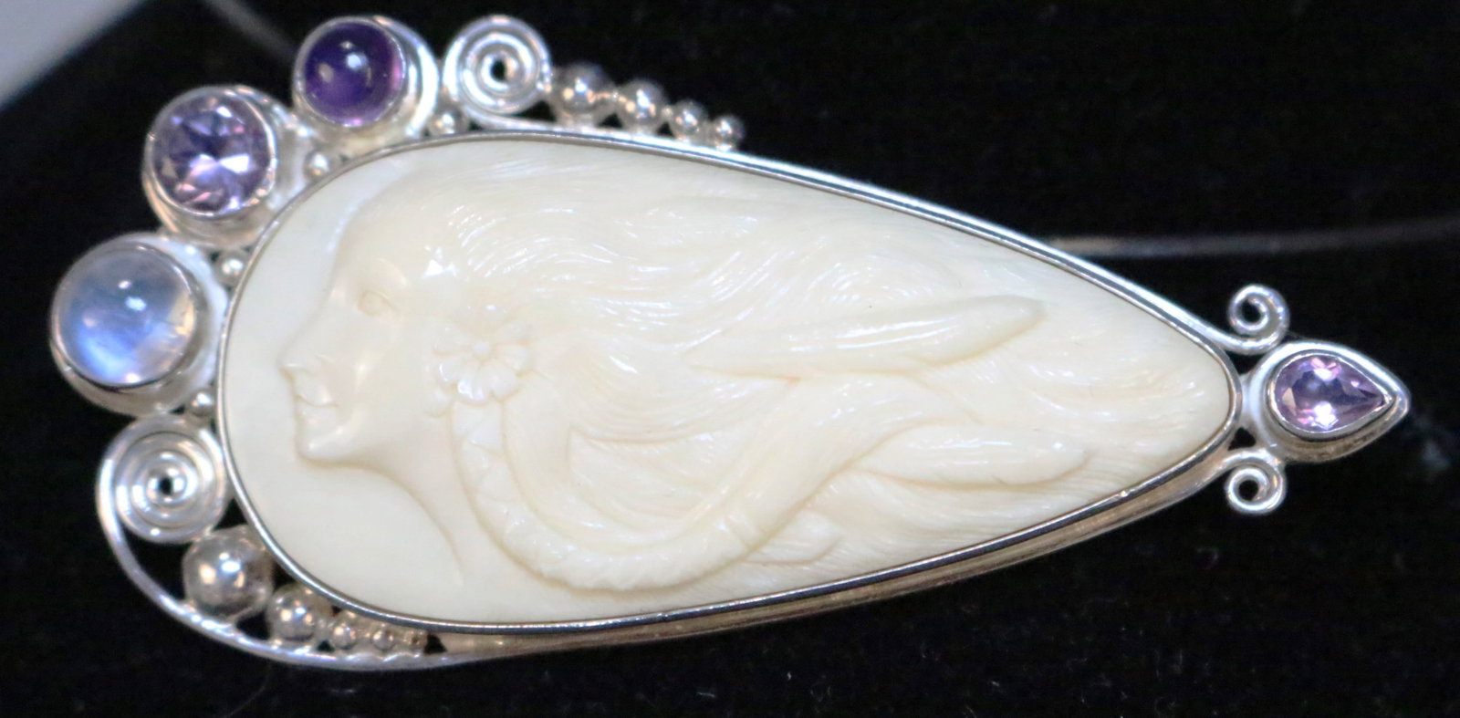 RARE SAJEN HUGE Ivory color Bone Carved Goddess Amethyst & Moonstone Sterling silver Brooch Pendant: GORGEOUS HUGE TEARDROP DESIGN WOMAN GODDESS WITH BRAIDED HAIR, FLOWERS IN A WINDSWEPT MOTION SUPER LONG BROOCH PENDANT OVER 3" LONG! X 1.5" high. Features: 6-8mm Moonstone amethyst stones. There are 2