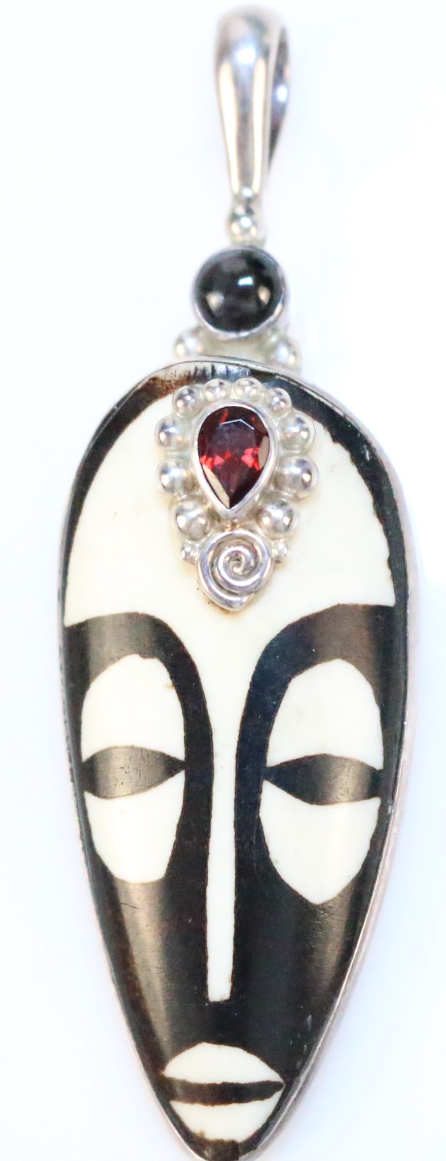 RARE SAJEN Ivory & brown mudstone large Goddess Tribal Native gemstone Sterling silver Pendant: FABULOUS Design in what appears to be Ivory colored bone dyed or mudstone in a tribal goddess face with a large nearly 1 carat garden set in sterling silver and a black onyx cab gemstone. LONG Pendant