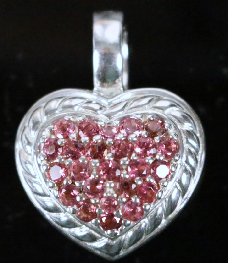Judith Ripka Sterling Silver Pink CZ large puffy 2 sided Heart Pendant Charm Enhancer: Big puffy heart with opening clasp. Brilliant pink CZ's in puffy rope setting with rope and textured revers side. This is just under 1" x 1.25" with the bale. It's 1/2" thick Hallmarked JUDITH RIPKA 9