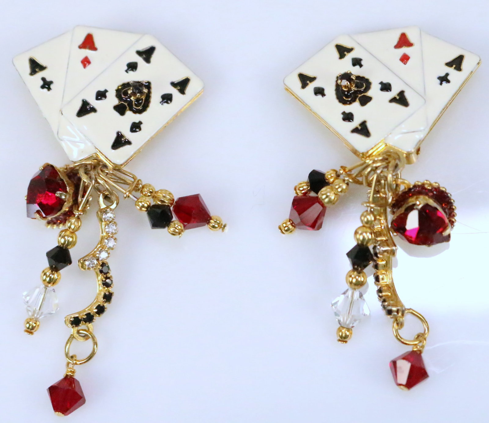 Lunch At The Ritz USA Poker Canasta Card Game Earrings: SO MUCH FUN! Clip Earrings. Signed: Lunch At The Ritz on the back. Features 3 Large Enamel Aces in spades, clubs and diamonds with Large dangling red Hearts , black clear and red Austrian crystals dan