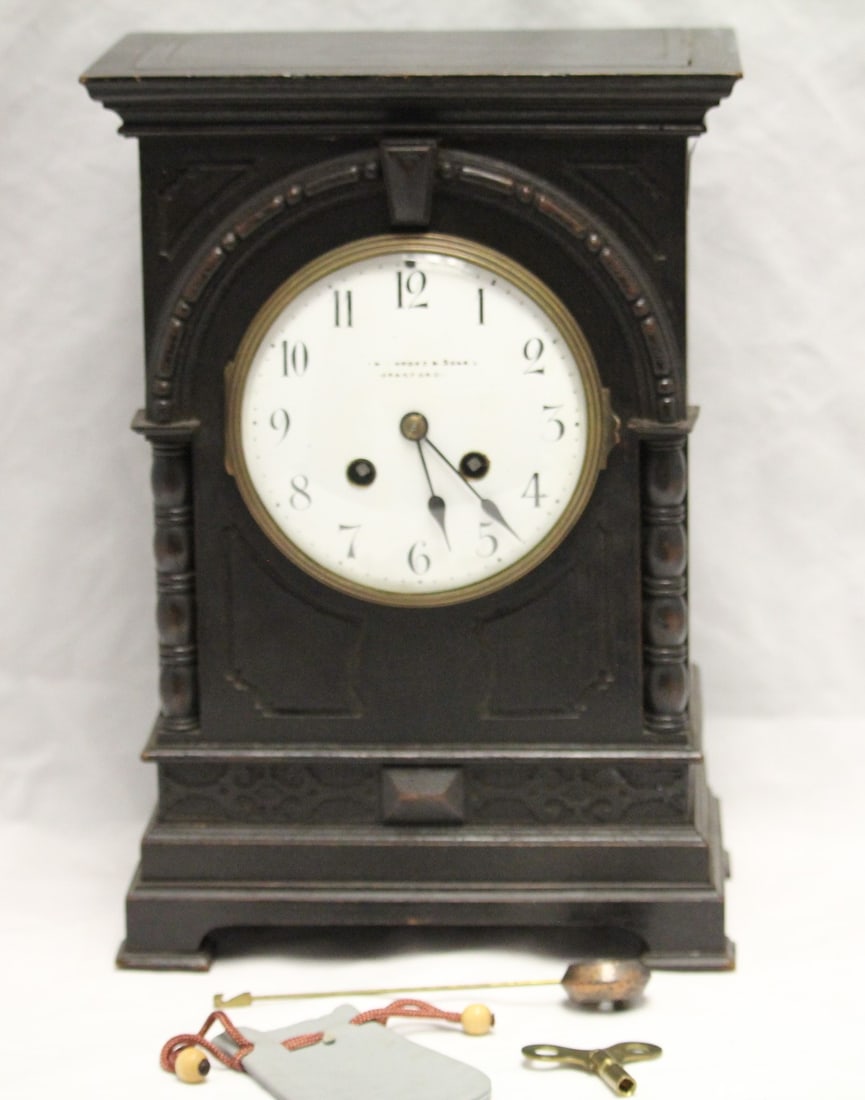 Vintage Manoah Rhodes & Sons 1800's Clock: Approx. 12.5" height. Vintage Manoah Rhodes & Sons 1800's mantel clock with key and pendulum. Not tested.