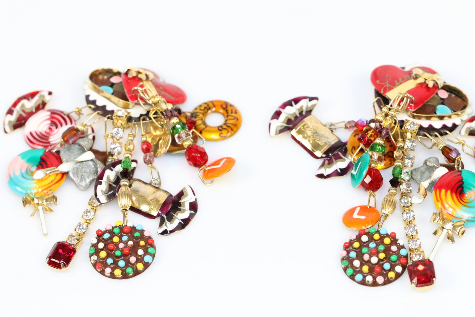 Lunch at the Ritz 22kt Gold Plated Swarovski Love Valentines Candy Earrings: MADE IN THE USA Huge Clip Earrings with assorted Candies and Large hearts Clip Earrings. Hallmarked Lunch At The Ritz. Measures: approx. 2.5" wide x 4" long. Laded with "candies, enamel, and drip crys