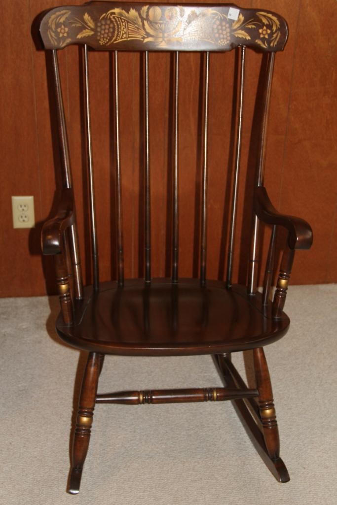 Hitchcock Mahogany with gold painted design and accents Large Rocking Chair: Hitchcock Mahogany Rocking Chair; decorative painted scroll design on headrest 41" h x 24" wide arm to arm outside measurement x 19.5" seet depth x 14" seat height.