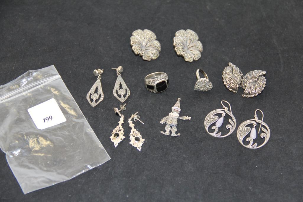 Lot of Marcasite earrings, rings and pendant: Lot includes 5 pair of earrings, 2 rings sizes _ heart is 4.5 and large with black onyx is size 8., and 1 pendant weighs 80 grams Pendant is 1.5" long