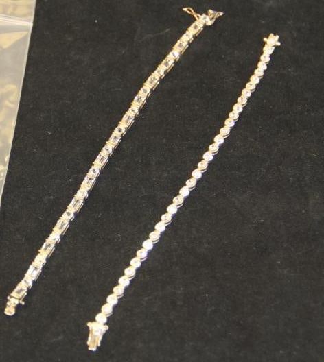 Lot of 2 Sterling silver CZ tennis bracelets. : Total weighs is 30.44 grams. Measure 7" & 7.5" long.