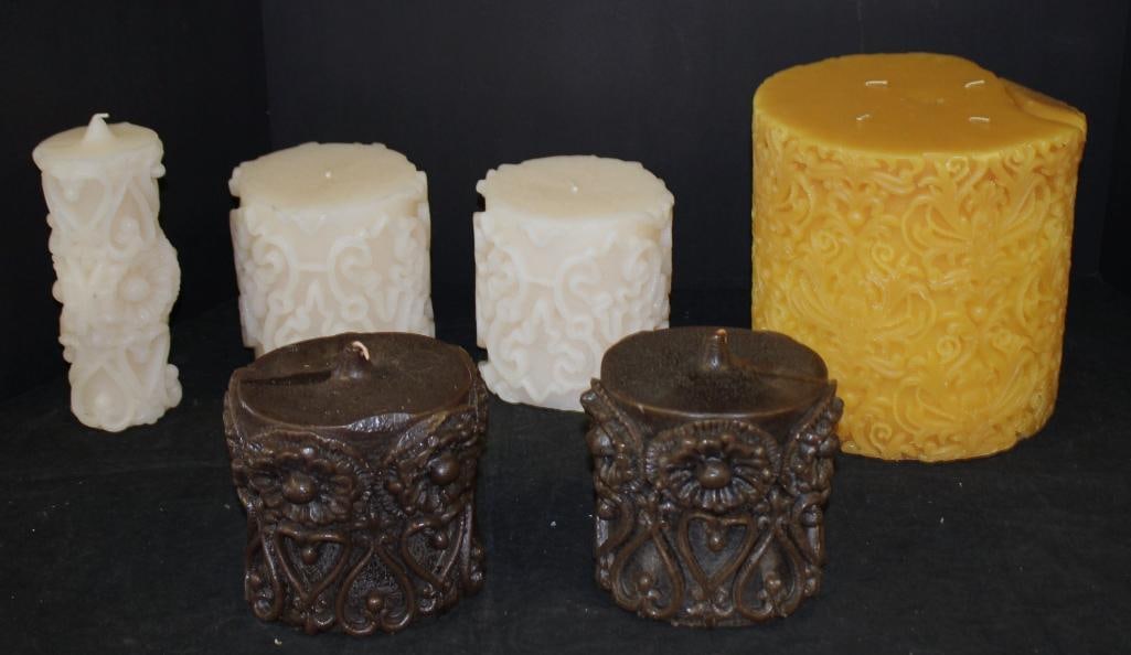 NEW Lot of 6 Anthropoly Assorted sized Decorative Carved Candles Ivory, Brown and Gold: cream colored 2 5.5" tall x 4.5" diameter , 2 brown oval 5" tall x 4.5" long, 1 cream candle- 7.25" tall, 4 wick orange gold candle (8" tall x 8" diameter)