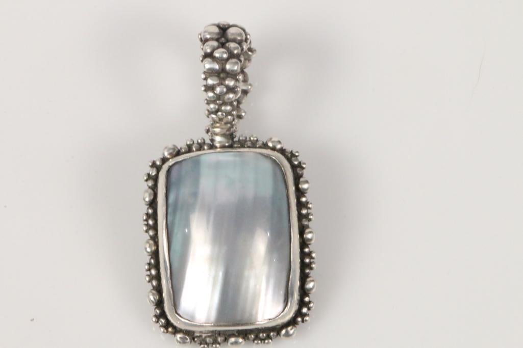 Designer Stephen Dweck Sterling Silver Huge Mother of Pearl Pendant: Amazing gorgeous huge rectangular luminescent mother of pearl rainbow shades measuring approx. 26mm x 20mm set in solid beaded sterling silver setting with beaded clasp that opens and lock closure. HA