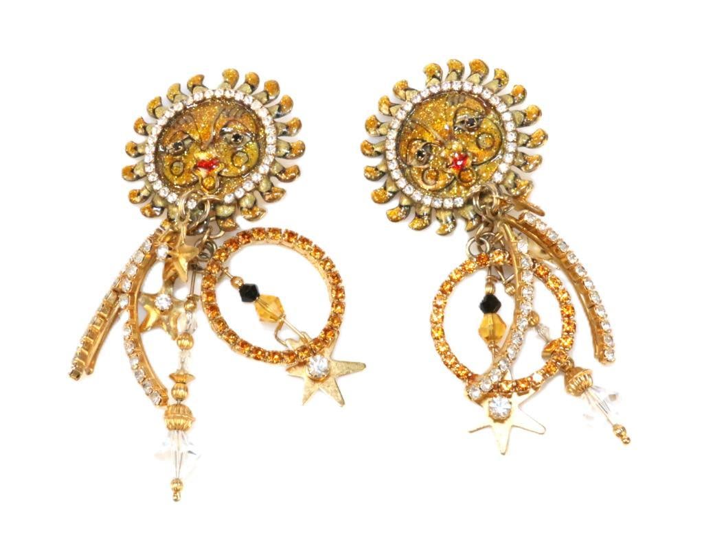 LUNCH AT THE RITZ 24 Kt gold plated Solar Loops Sun Clip Earrings: MADE IN THE USA. Signed Lunch at the Ritz. Large 3.25" long x 1.5" wide. Loades with shimmer, glimmer and glitzy crystal and enamel with gold stars.
