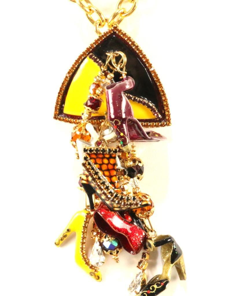 LUNCH AT THE RITZ 24 Kt gold plated Heels Huge brooch pendant necklace *MATCHES LOT 249: MADE IN THE USA. Signed Lunch at the Ritz.omes with a gold tone chain (not lunch at the jritzzz0. Brooch is Loaded with enamel shoes of al kinds and styles in an array of colors with strands of colorf