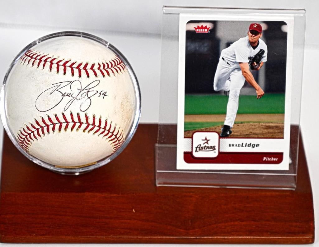 Brad Lidge Houston Astros/Philadelphia Phillies Autographed 94 Baseball on Stand with Card - Black : This rare and highly coveted AUTHENTIC collector’s autographed 94 Baseball on Stand with Card by Brad Lidge from Houston Astros/Philadelphia Phillies represents a piece of Baseball History. Pres