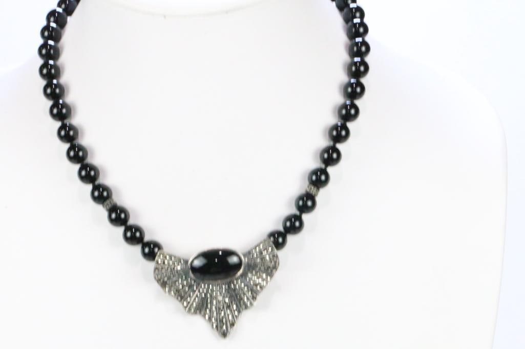 Vintage JJ Sterling Silver Marcasite Black Onyx Necklace 52.3 grams.: Stunning sterling silver and black onyx large round beads with marcasite fan focal pendant attached with a huge large oval black onyx cabochon. Measures: approx. 22mm x 14mm cab. Sterling marcasite fa