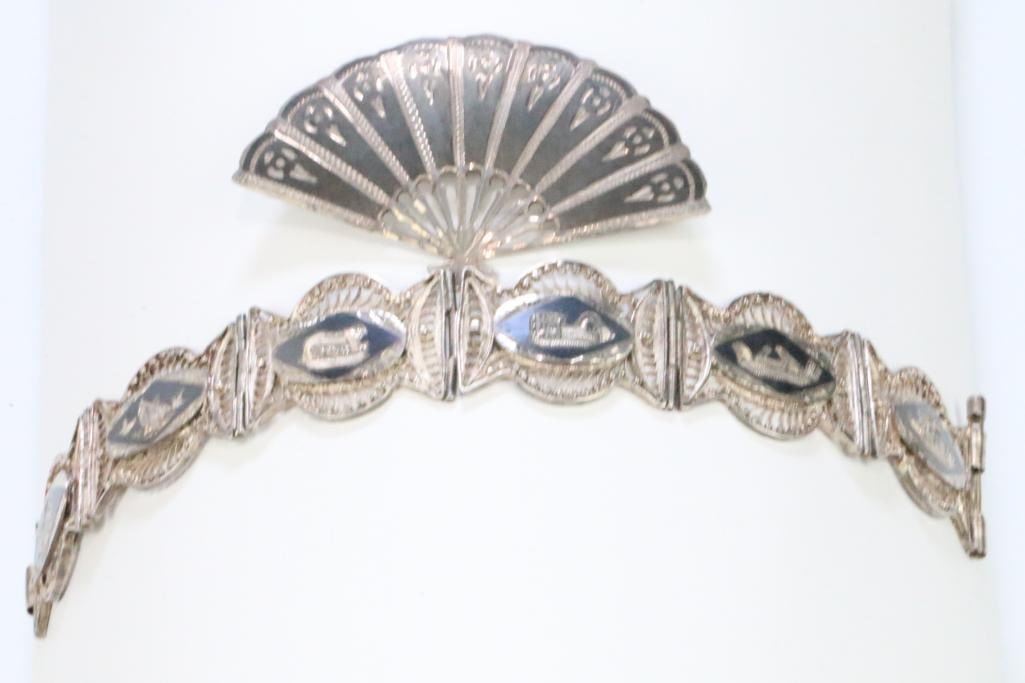 Antique Sterling Silver Siam Bracelet and brooch: Weighs 31.2 grams. Bracelet is lovely antique filigree design with slide bar secure clasp. bracelet measures: 7" long x 1" wide. No hallmarks on the bracelet. Brooch is hallmarked SIAM STERLING. Brooc