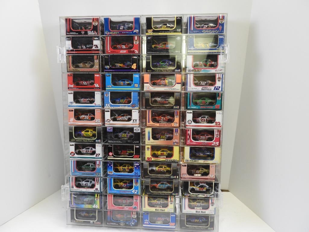 lot of 48 NASCAR 1/64 scale diescast stock car replicas IN BOXES inside a large clear display case (1 of 13)