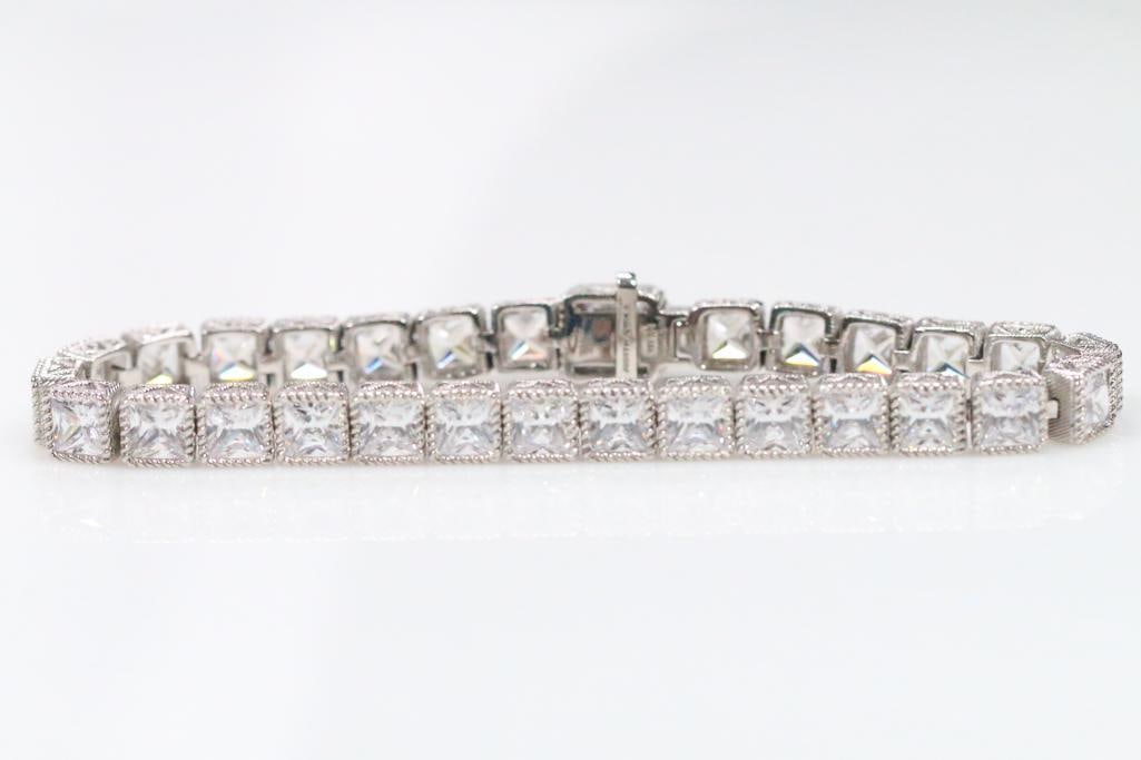 NEW Judith Ripka Sterling Silver large princess cut Diamonique cz's tennis bracelet.: New in storage bag, sterling silver and crystal bracelet 7 3/4" long. BRILLIANT STUNNING!