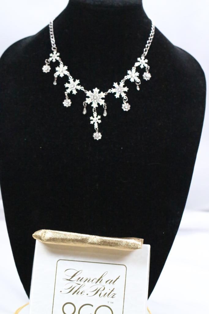 New Lunch At The Ritz latr2go Enamel and Cystal Snowflake Palladium Silver Necklace, Signed: New in box with storage pouch, snowflake drop necklace with silver toned metal, enamel and crystal fleurettes, worn from approx. 17-20" with extender chain and lobster clasp. silvertone palladium heav