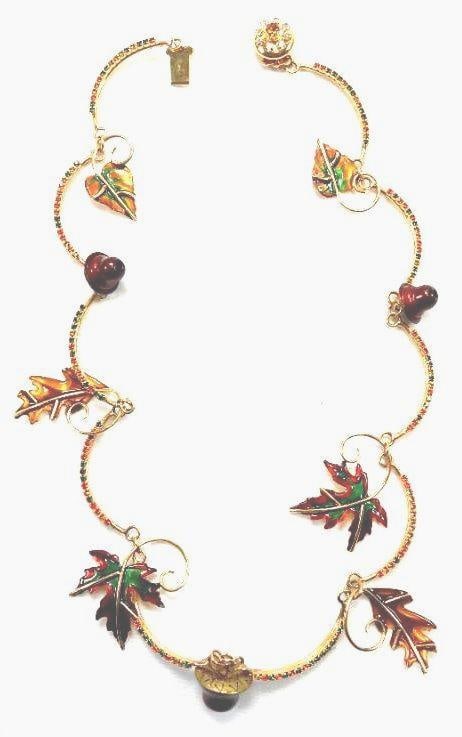 Lunch at The Ritz USA 22KT Gold Plated Fall Leaves Necklace: Enameled leaves and acorns dangle from this unusual Fall-themed necklace made of 22Kt Gold Heavy plating crafted in the USA . Genuine Austrian Crystals. 16.5" long.