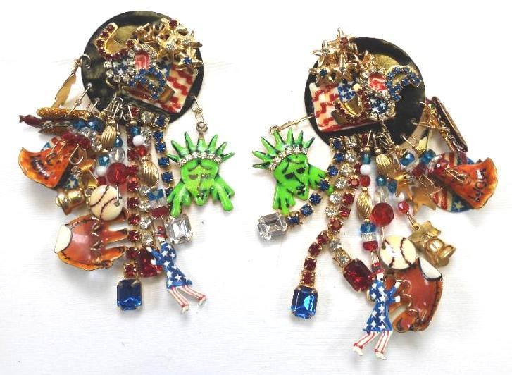 Lunch at The Ritz USA 22KT Gold Plated American Icons Earrings: Fun patriotic American Icon dangling clip on earrings with flag, baseball, apple pie, hot dogs, Libert Bell and Staue of Liberty; made with 22Kt Gold Heavy plating in the USA . Genuine Austrian Crysta