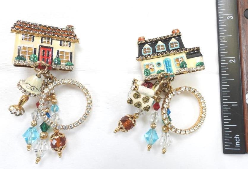 Lunch at The Ritz USA 22KT Gold Plated Dream House Earrings: Charming Dream House enameled clip on earrings with dangling charms, made with 22Kt Gold Heavy plating in the USA . Genuine Austrian Crystals. 3" long