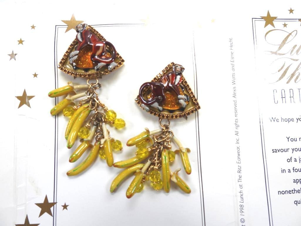 Lunch at The Ritz USA 22KT Gold Plated Earrings "Monkey Business": Detailed enamel monkeys and hanging banana bunches adorn these fun clip earrings made with 22Kt Gold Heavy plating in the USA . Genuine Austrian Crystals. 1.25x 3.5" long