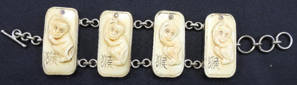 Amy Kahn Russel Sterling Silver "Year of the Monkey" Bracelet: Oblong medallions with carved monkeys, sterling silver, 1 7/8"x 8 1/2"
