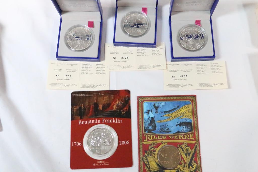 Monnaie De Paris Coin Lot 4 Silver proof Coins and 1collectible Jules Verne: Numismatic. Lot includes: 3 New uncirculated 2005 silver proof coins : From the earth to the moon no. 1750/ 5000, Around the works in 80 days No. 4805/5,000. 20,000 Leagues Under the Sea #3777/5000 mi
