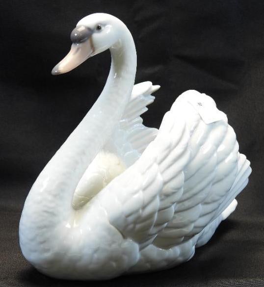 LLADRO Porcelain Figurine, "Swan With Wings Spread" #5231, 1983, SIGNED and STAMPED: Lovely and detailed porcelain figurine of a white swan with wings spread, #5231 dated 1983; approximately 7.5"x 7.5", the figurine showcases the beautiful and delicate glossy transparent glazes Lladro